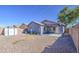 View of the backyard with covered patio, low maintenance gravel, and storage shed at 6428 W Cordes Rd, Phoenix, AZ 85043