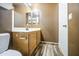 Bathroom features wood-look flooring and a wood vanity at 6428 W Cordes Rd, Phoenix, AZ 85043