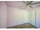 Bedroom features a ceiling fan and closet with sliding doors at 6428 W Cordes Rd, Phoenix, AZ 85043