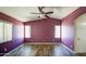Bedroom with wood floors, ceiling fan, and natural light from multiple windows at 6428 W Cordes Rd, Phoenix, AZ 85043