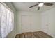 Bedroom features a ceiling fan, closet with sliding doors, and natural light at 6428 W Cordes Rd, Phoenix, AZ 85043