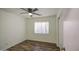 Bedroom with a ceiling fan and wood-look flooring at 6428 W Cordes Rd, Phoenix, AZ 85043