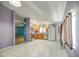 Open kitchen featuring wood cabinets, stainless steel appliances, and white tile flooring at 6428 W Cordes Rd, Phoenix, AZ 85043