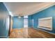 Bright living area with wood floors, large window, and vaulted ceiling at 6428 W Cordes Rd, Phoenix, AZ 85043