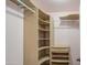 Walk-in closet with wood shelving and racks at 6428 W Cordes Rd, Phoenix, AZ 85043