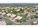Aerial view of a residential neighborhood featuring manicured lawns, swimming pools, and tree-lined streets at 722 N Butte Ave, Chandler, AZ 85226