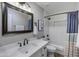 Tastefully designed bathroom featuring a bathtub with subway tile surround, modern vanity, framed mirror, and sleek finishes at 722 N Butte Ave, Chandler, AZ 85226