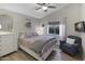 Comfortable bedroom with soft lighting, plush bedding, a cozy chair, and ample natural light, creating a relaxing retreat at 722 N Butte Ave, Chandler, AZ 85226