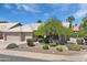 Charming home exterior with mature landscaping, a lush tree, and a well-maintained yard at 722 N Butte Ave, Chandler, AZ 85226