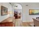 Open living space showing archway, hardwood floors and glimpses of fireplace and dining areas at 722 N Butte Ave, Chandler, AZ 85226