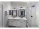 Stylish main bathroom featuring dual sinks, modern fixtures, a glass-enclosed shower, and contemporary design at 722 N Butte Ave, Chandler, AZ 85226