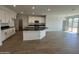Spacious eat-in kitchen with an island and stainless steel appliances at 7433 W Rovey Ave, Glendale, AZ 85303