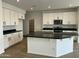 Bright eat-in kitchen featuring modern stainless steel appliances and granite countertops at 7433 W Rovey Ave, Glendale, AZ 85303