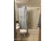 Cozy bathroom featuring a shower-tub combination and patterned shower curtain at 7474 E Earll Dr # 201, Scottsdale, AZ 85251