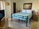 Relaxing bedroom with a queen bed, two nightstands, two lamps and a nature painting at 7474 E Earll Dr # 201, Scottsdale, AZ 85251