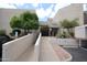 Building exterior with a handicap ramp that leads to the entrance of the condo at 7474 E Earll Dr # 201, Scottsdale, AZ 85251