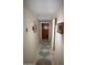 Inviting hallway with tiled floors and decorative wall art at 7474 E Earll Dr # 201, Scottsdale, AZ 85251