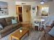 Comfortable living room with hardwood floors, ceiling fan and open access to the kitchen at 7474 E Earll Dr # 201, Scottsdale, AZ 85251