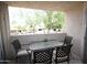 Relaxing outdoor patio features a table and four chairs with a view of the neighborhood at 7474 E Earll Dr # 201, Scottsdale, AZ 85251