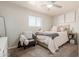 Inviting bedroom with ceiling fan, light gray walls, a queen bed, and a gray accent chair at 808 N 78Th St, Scottsdale, AZ 85257