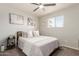 Comfortable bedroom featuring a ceiling fan, light gray walls, a queen bed, and lots of light at 808 N 78Th St, Scottsdale, AZ 85257