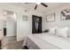 Bedroom featuring a ceiling fan, light gray walls, a queen bed, and an ensuite bathroom entrance at 808 N 78Th St, Scottsdale, AZ 85257