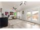 Cozy living room with ceiling fan, desk, and patio access at 808 N 78Th St, Scottsdale, AZ 85257