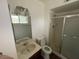 Bright bathroom with a shower, toilet, vanity, and an open, airy feel at 836 W Laguna Azul Ave, Mesa, AZ 85210