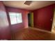Bedroom boasting wood-look floors and a large window offering plenty of natural light at 836 W Laguna Azul Ave, Mesa, AZ 85210