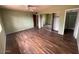 Spacious bedroom with wood floors, a closet, and an en-suite bathroom at 836 W Laguna Azul Ave, Mesa, AZ 85210
