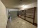 Spacious garage featuring shelving for storage at 836 W Laguna Azul Ave, Mesa, AZ 85210