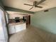 Open kitchen and dining area with stainless steel appliances and tile flooring at 836 W Laguna Azul Ave, Mesa, AZ 85210