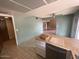 Bright kitchen with a view into another room and stainless appliances at 836 W Laguna Azul Ave, Mesa, AZ 85210