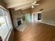 An open living room with a brick fireplace and hardwood floors at 836 W Laguna Azul Ave, Mesa, AZ 85210