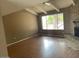 Bright living room with brick fireplace and hardwood floors at 836 W Laguna Azul Ave, Mesa, AZ 85210