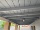 Covered patio ceiling with wood planks and outdoor lighting at 836 W Laguna Azul Ave, Mesa, AZ 85210