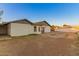 Backyard with a patio area and dirt ground at 8717 W Turney Ave, Phoenix, AZ 85037