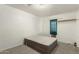 Neutral bedroom with carpeted floors, a built in closet, and natural light at 8717 W Turney Ave, Phoenix, AZ 85037