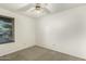 Neutral bedroom with carpet and ceiling fan and natural light from the window at 8717 W Turney Ave, Phoenix, AZ 85037