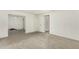 Bedroom featuring carpeted floors and two access doors to connecting rooms at 8717 W Turney Ave, Phoenix, AZ 85037