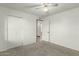 Cozy bedroom with carpet, a spacious closet, and easy access to connecting rooms at 8717 W Turney Ave, Phoenix, AZ 85037