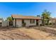 A charming single-story home with desert landscaping and mature trees in a residential neighborhood at 8717 W Turney Ave, Phoenix, AZ 85037