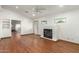 Bright living room with hardwood floors, a modern fireplace, and an abundance of natural light at 8717 W Turney Ave, Phoenix, AZ 85037