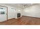 Bright living room with hardwood floors and a modern fireplace at 8717 W Turney Ave, Phoenix, AZ 85037