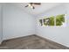 Bedroom with ceiling fan, carpeted floor and view from the window at 8754 W Karen Lee Ln, Peoria, AZ 85382