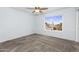Bedroom with ceiling fan, carpeted floor and view from the window at 8754 W Karen Lee Ln, Peoria, AZ 85382