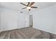 Bedroom with ceiling fan, carpeted floor and closet at 8754 W Karen Lee Ln, Peoria, AZ 85382