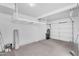 Spacious garage with high ceilings and overhead storage racks for organization at 8754 W Karen Lee Ln, Peoria, AZ 85382