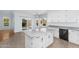 Bright kitchen with white cabinets, grey countertops and tile floors at 8754 W Karen Lee Ln, Peoria, AZ 85382