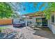 Backyard features a covered patio, hot tub, and dining area, perfect for outdoor entertaining and relaxation at 8930 W Sells Dr, Phoenix, AZ 85037